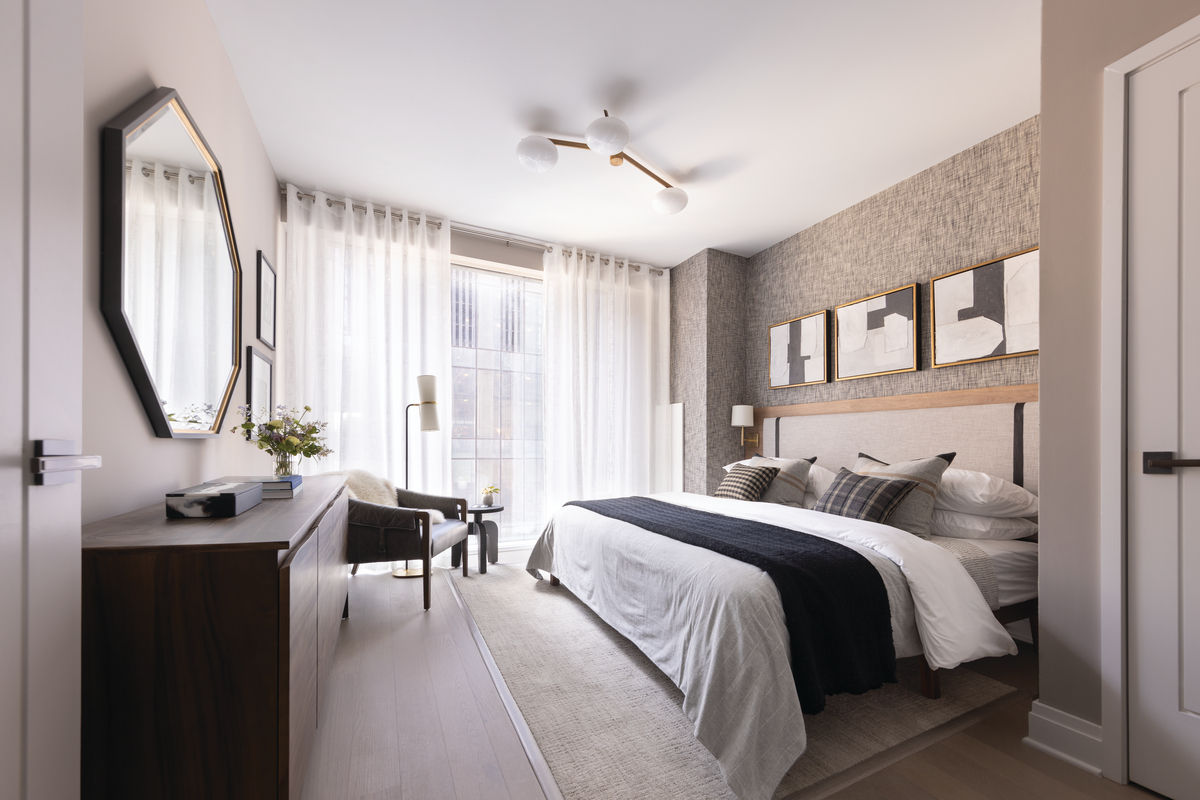 Coterie Hudson Yards apartment bedroom with king sized bed, luxury decor and floor to ceiling windows
