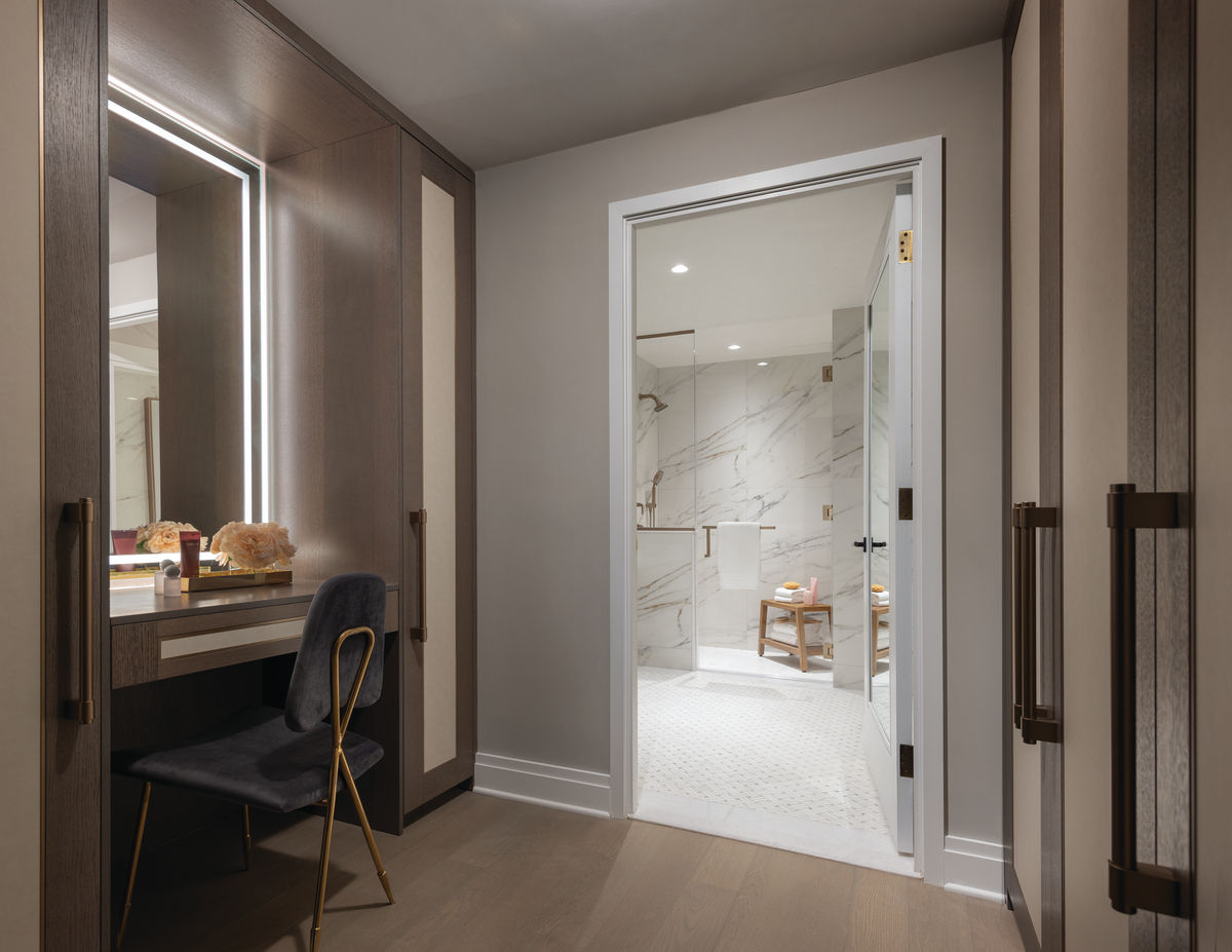 Coterie Hudson Yards apartment bathroom with tiled walk in shower and makeup vanity