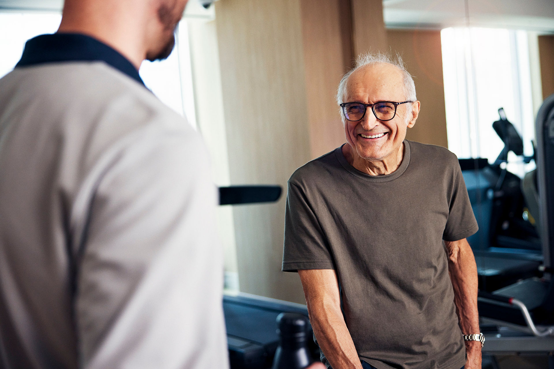 Senior man smiling at caregiver