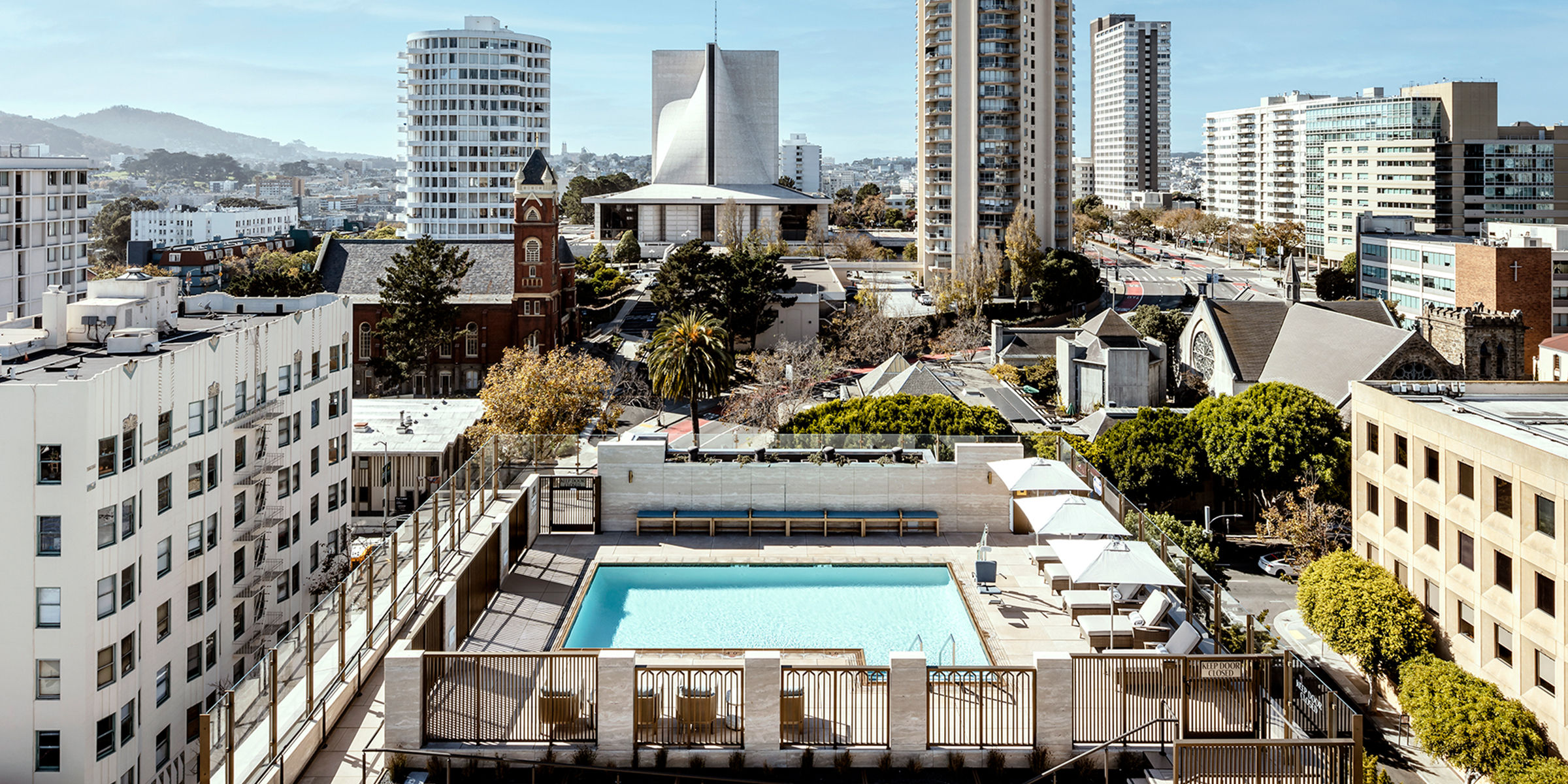 Aerial view of the heated rooftop pool at Coterie Cathedral Hill